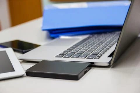 Laptop computer on desk table in work office Photos