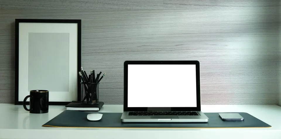 Laptop computer, digital tablet and houseplant on white table. Stock-Fotos