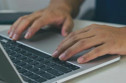 Laptop computer digital technology online. Businessman hand typing keyboard n Stock Photos