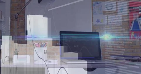 Laptop computer displaying code interface and data graph in home office with Stockfoto's