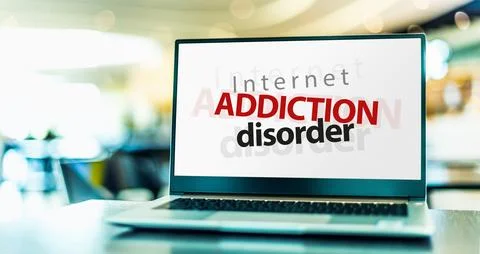 Laptop computer displaying the sign of Internet addiction disorder, a problem Stock Photos