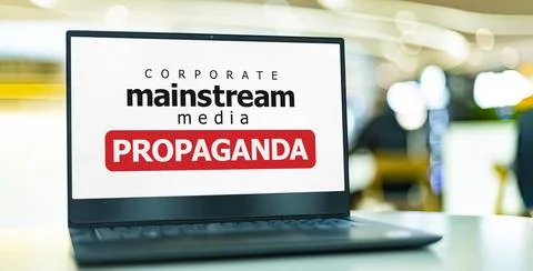 A laptop computer displaying the watchword: mainstream media propaganda Stock Photos