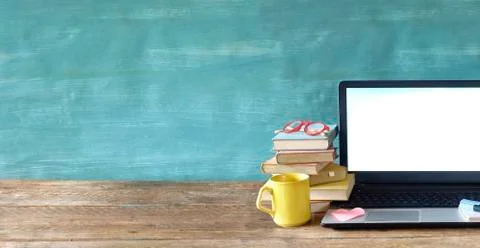 Laptop computer with empty screen, books and eyeglasses, learning,business,ho Stock Photos