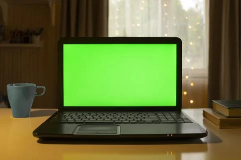 Laptop Computer with Green Mock-up Screen. Green Screen Device Stands on a De Stock Photos