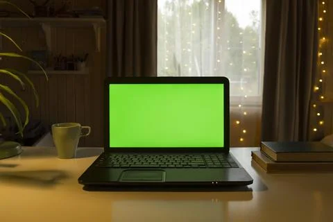Laptop Computer with Green Mock-up Screen. Green Screen Device Stands on a De Stock Photos
