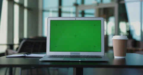 Laptop computer with green screen in bri... | Stock Video | Pond5