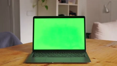 Laptop computer with Green screen Chroma key Mock-up on working desk in office Stock Footage 224900767