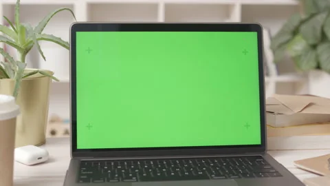 Laptop Computer with Green Screen in Cozy Office Interior Video stock 180416312