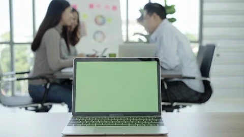 Laptop computer with green screen on table in office. Chroma key. Stock Footage 94046053
