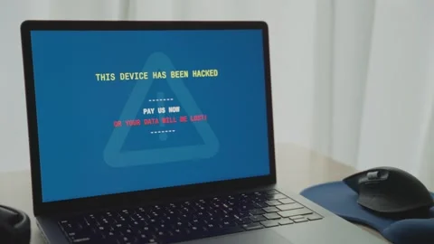 Laptop computer is hacked by cyber criminal team requesting ransom from user 스톡 동영상 342512273