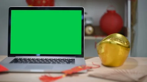 A laptop computer with a key green screen set on work office table. Stock Footage 103362704