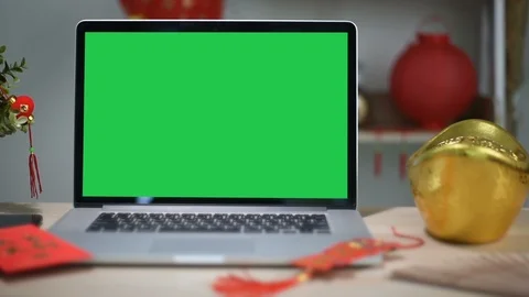 A laptop computer with a key green screen set on work office table. Stock Footage 103363940