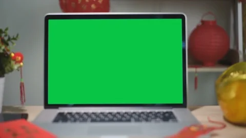 A laptop computer with a key green screen set on work office table. Stock Footage 103365766