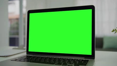 A laptop computer with a key green screen set on work office table. Modern lapto Stock Footage 170589207