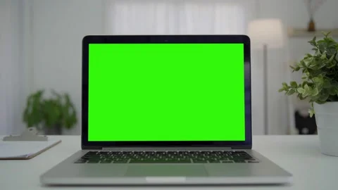A laptop computer with a key green screen set on work office table. Modern lapto Stock Footage 170589313