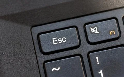 Laptop computer keyboard Esc, escape key macro detail, top view, object closeup Foto stock
