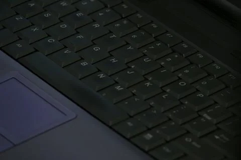A Laptop Computer Keyboard is Shown Up Close in a Diagonal View 스톡 사진