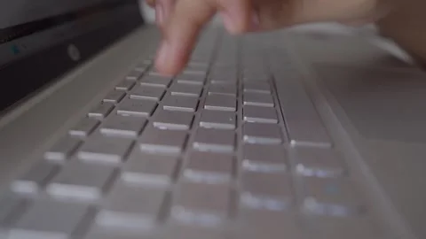 Laptop computer keyboard typing by one hand finger Stock Footage 293516639