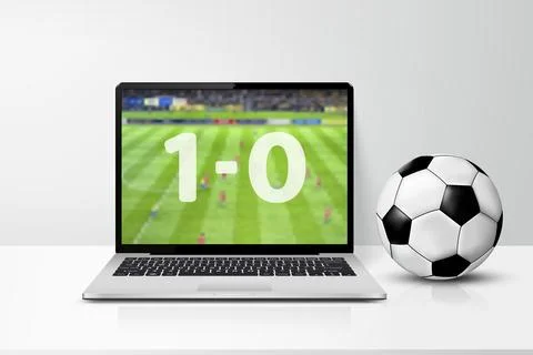 Laptop computer with live soccer match score on the screen and soccer ball on イラスト素材