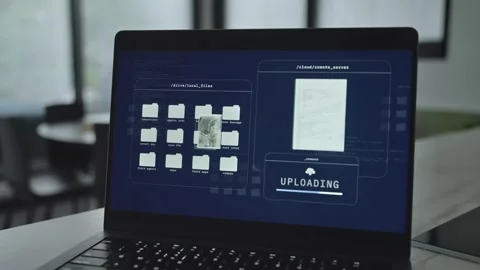 Laptop computer with malware or spyware stealing secret documents from server Stock Footage 311302396