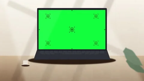 Laptop computer mockup with a green screen display in a workspace Stock Footage 347248123
