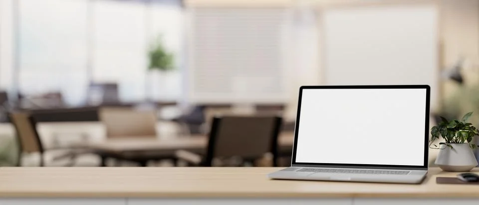 A laptop computer mockup on a table with a blurred background of a contempo.. Stock Illustration