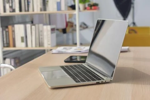 Laptop Computer Notebook on desk in office internet technology work online co Stock Photos