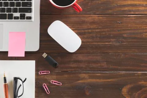 Laptop computer, pen and notebook on office desk - top view Stock Photos