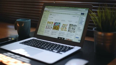 Laptop computer screen show ebay shopping online set on the table Stock Footage 98435309