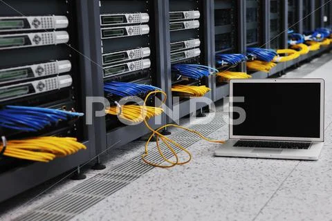 Laptop computer at server network room Stock Photos
