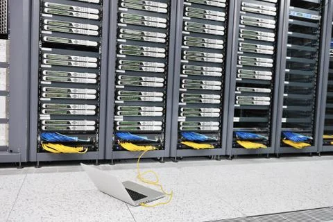 Laptop computer at server network room Stock Photos