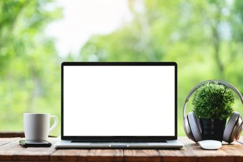 Laptop computer showing white frame morning nature background Foto stock
