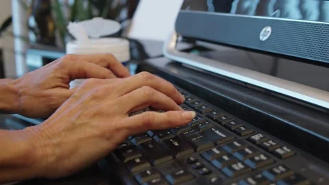 A laptop computer sitting on top of a keyboard Video stock 155540366