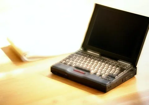 Laptop computer on table, blurred Stock Photos