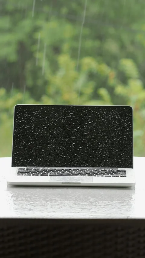 Laptop computer under heavy rain. Stock Footage 279601540