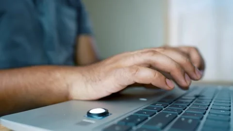 Laptop Computer in Use on a Neat Office Desk with Typing Hands Visible Stock Footage 315982808