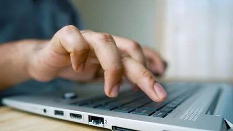 Laptop Computer in Use on a Neat Office Desk with Typing Hands Visible Stock Footage 315982825