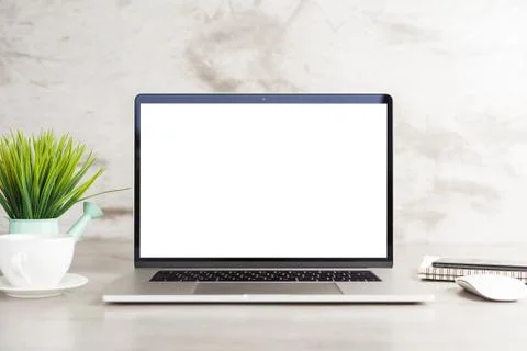Laptop computer white blank screen on work table front view Foto stock