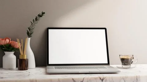 A laptop computer white-screen mockup on a white marble table against the w.. Stock Illustration