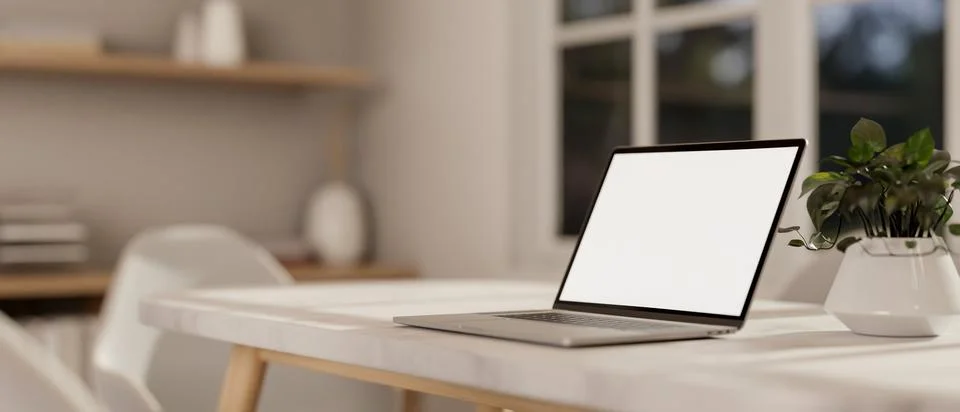 A laptop computer with a white-screen mockup on a white table in a minimali.. Stock Illustration