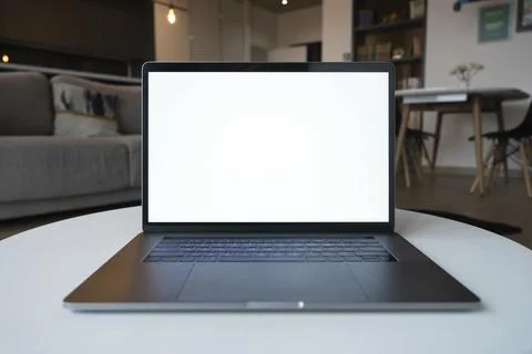 Laptop computer with white screen mockup for advertising application. Stock Photos