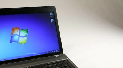 LAPTOP COMPUTER WITH WINDOWS TRACKING SHOT Stock Footage 10727636