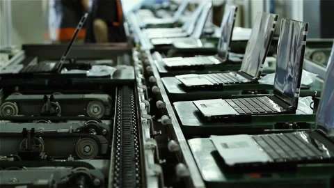 Laptop Computers Moving Along Conveyor Belt in Modern Electronics Factory - 4K Stock Footage 146696935