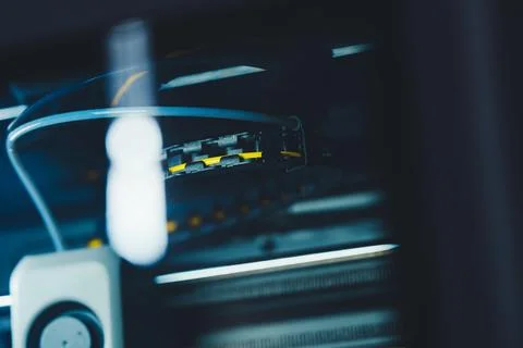 Laptop is connected to network equipment during installation at an office setup Stock Photos