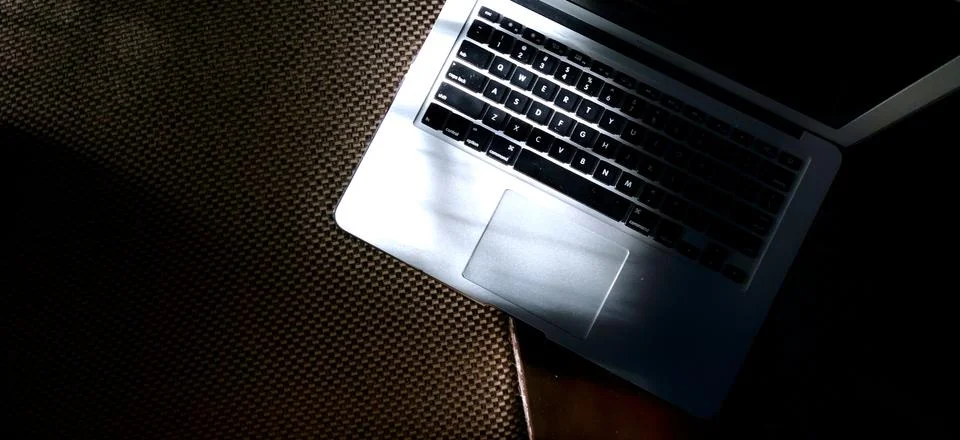 Laptop on the couch Stock Photos