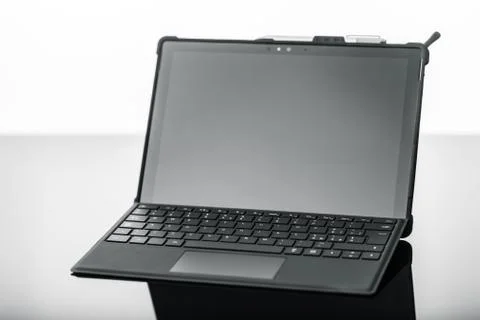 Laptop on dark surface Stock Photos