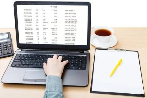 Laptop with data on screen on office table business still life - laptop wi... Stock Photos