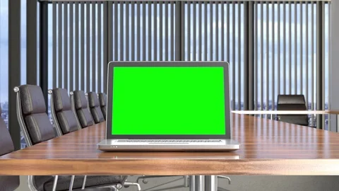 Laptop on desk in meeting room with track green screen Stock Footage