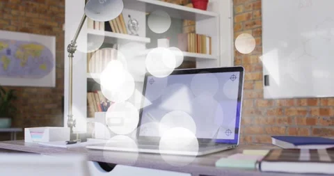 Laptop on desk, on overlay start bokeh triangles covering then fading to reveal Stock Footage 331286718
