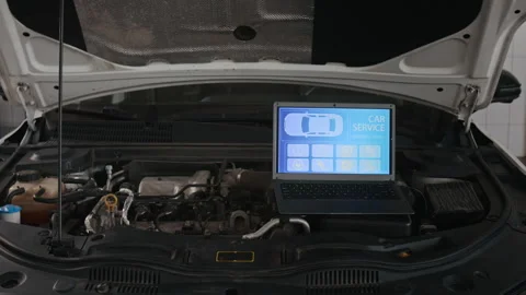Laptop with Diagnostics Software on Top of Engine during Car Checkup Stock Footage 329405973